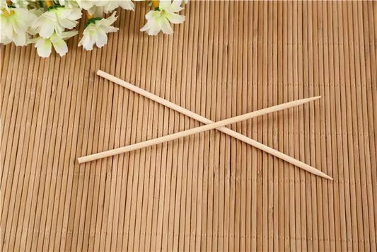 Bamboo skewers, two crossed sticks for grilling and appetizers