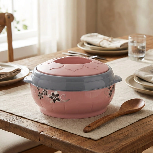 Pink insulated casserole dish with gray lid and floral pattern, round shape