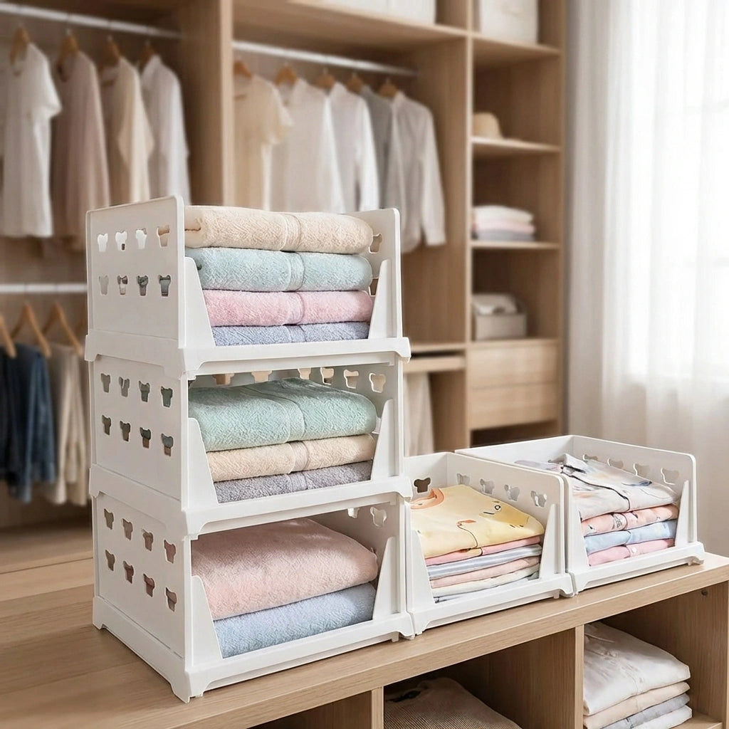 White modular storage drawer organizer with multiple open compartments for folded fabrics