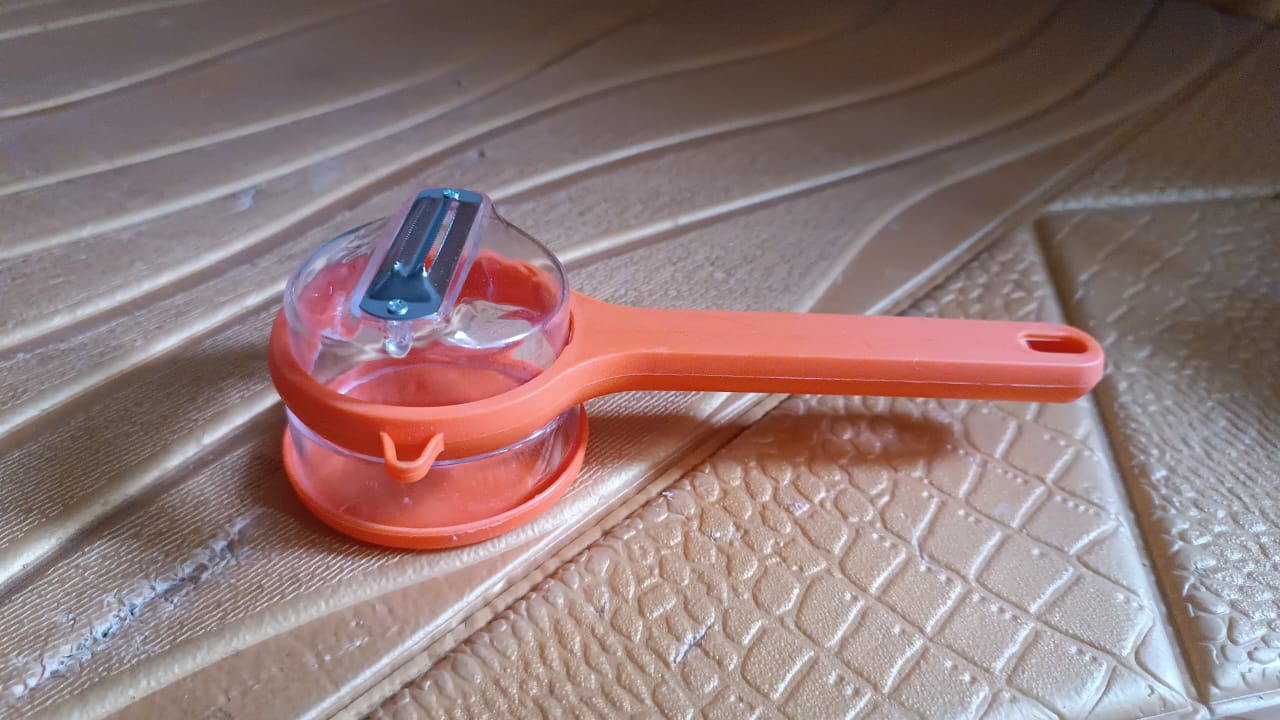 Peeler with Container
