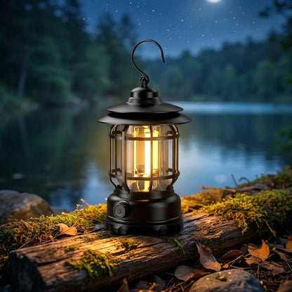 Retro camping lantern with black metal frame, glass sides, warm LED glow