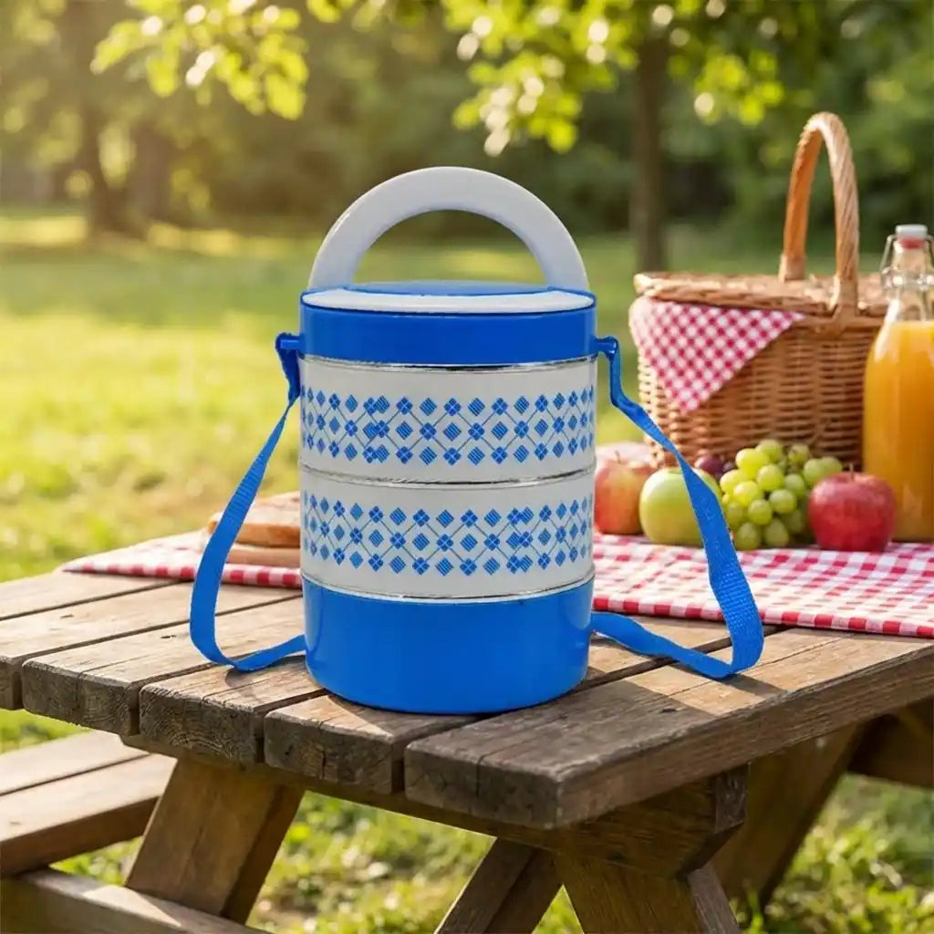 Blue patterned tiffin lunch container with two stacked sections and carry strap