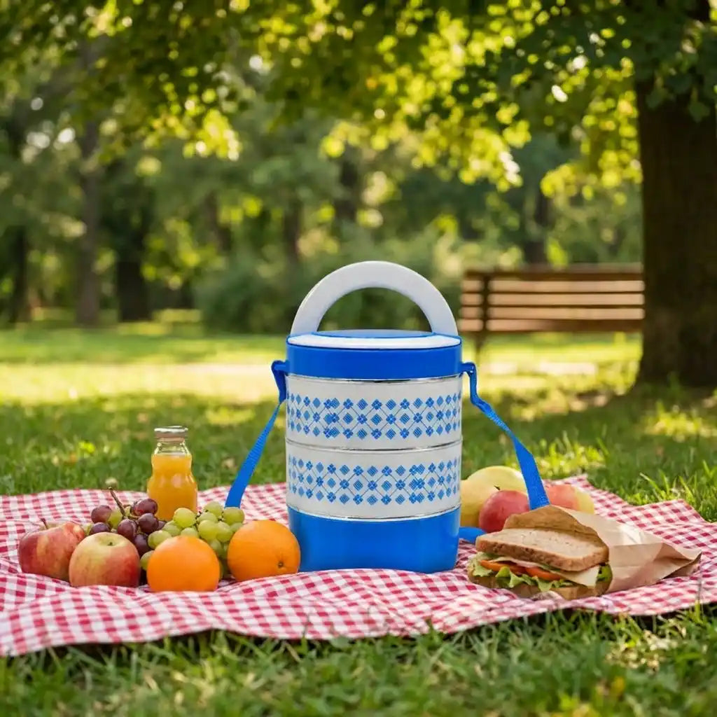 Blue patterned tiffin lunch container with white lid and long shoulder strap