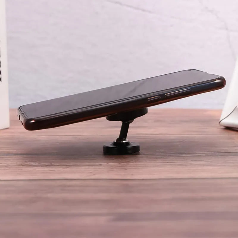 Magnetic rotating phone holder with black base and slim stand, angled view