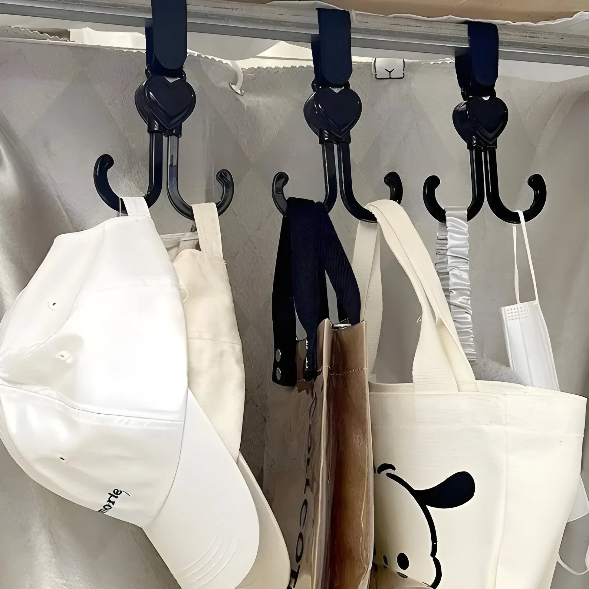 Stroller hooks with rotating J-shaped grips, navy and white, for hanging bags