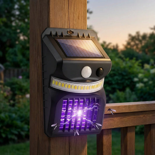 Solar bug zapper and light, black unit with solar panel and purple UV grid