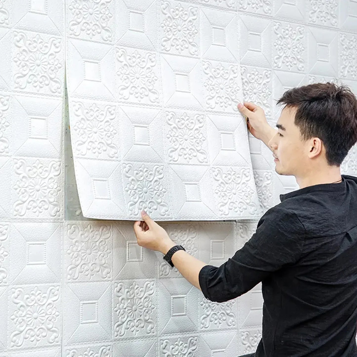 White 3D foam wall panel with geometric embossed pattern, relief tile design.