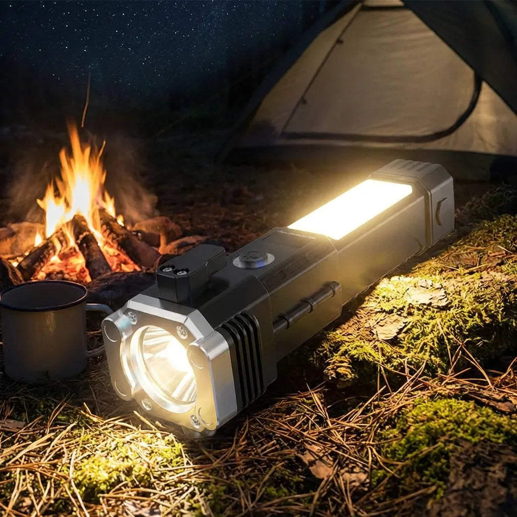 Rechargeable torch with side controls and glowing headlight, near campfire.