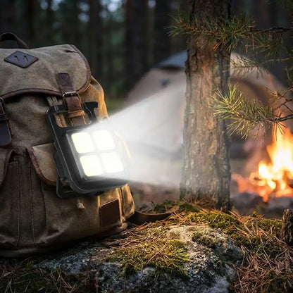 Mini keychain light with 4 LEDs, backpack-strap mounted