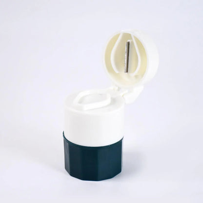 4-in-1 pill crusher and grinder with open white lid and black base