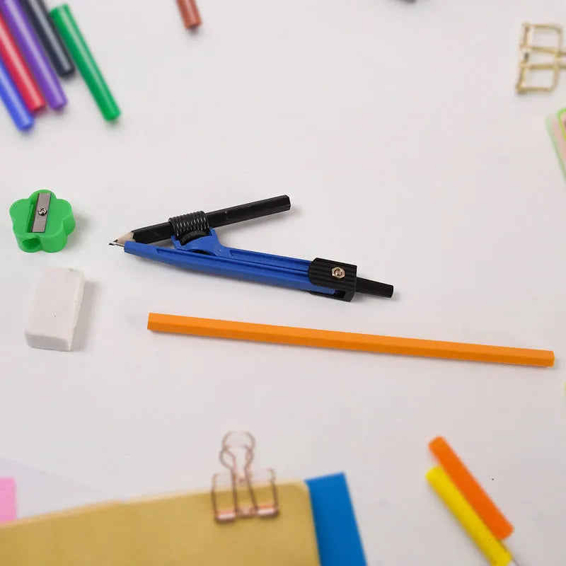 Stationery set with blue pen, orange pencil, yellow highlighter, and paper clips