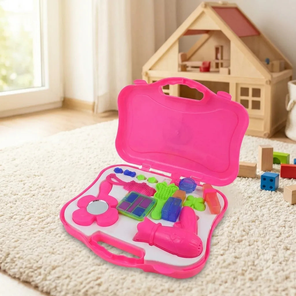 Pink toy briefcase beauty set, open with bottles, brush and tools