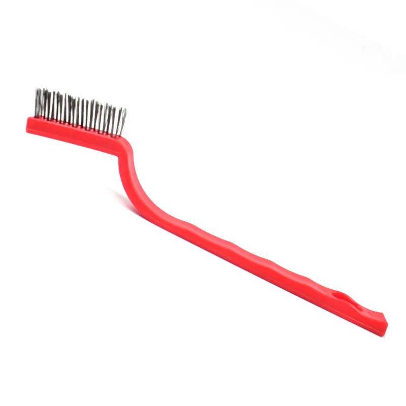 Mini stainless steel wire brush with red plastic handle and wire bristles