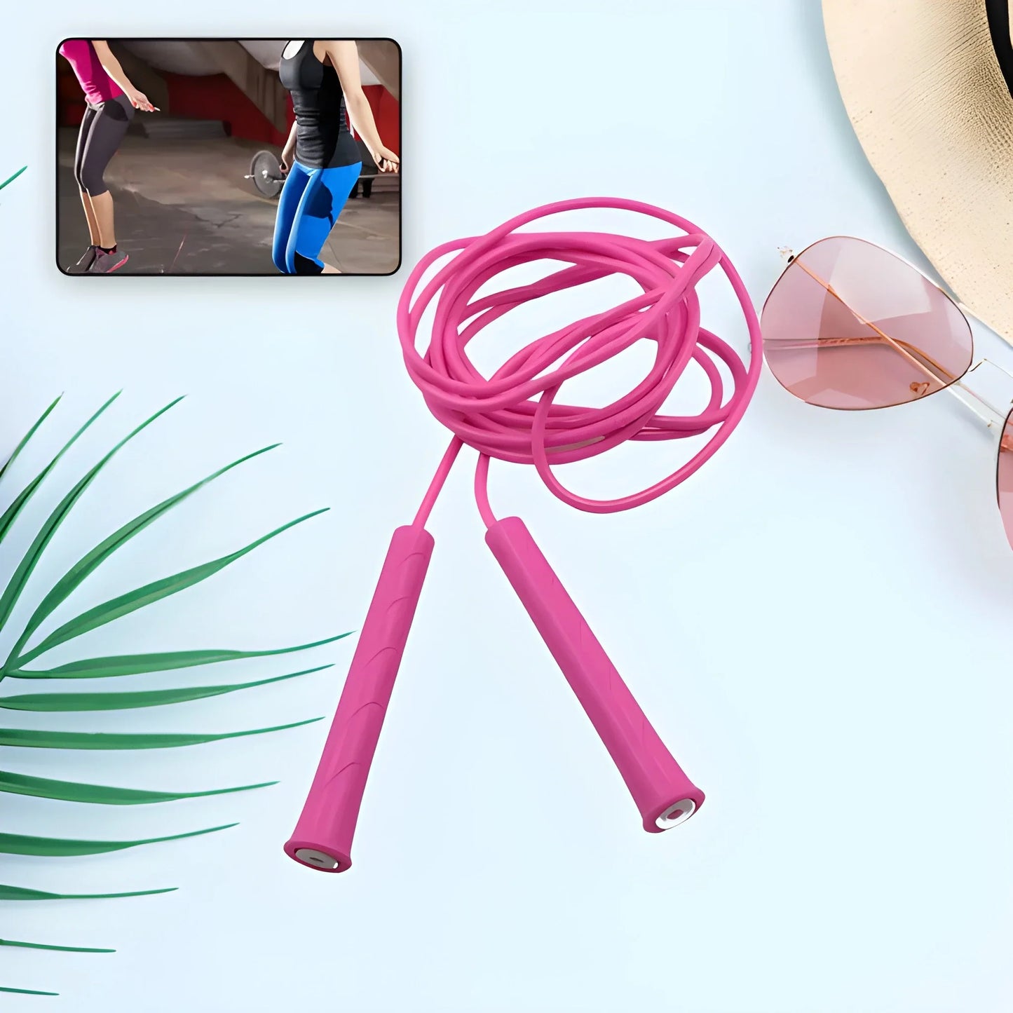 Pink adjustable speed jump rope with two foam handles and coiled cable