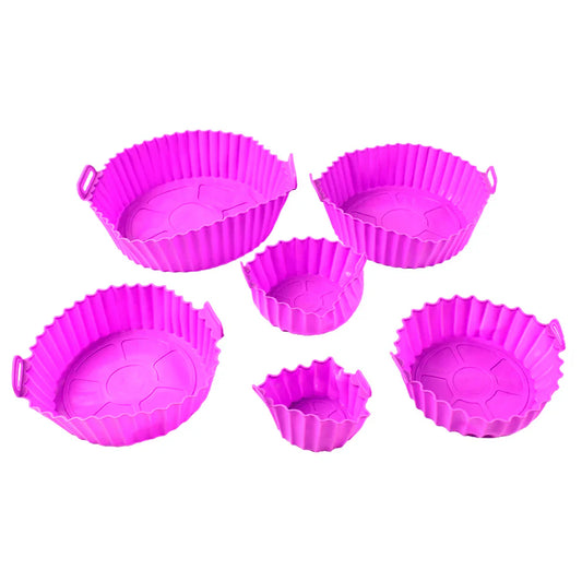 Pink silicone air fryer liners set with ridged, round bowls and handles