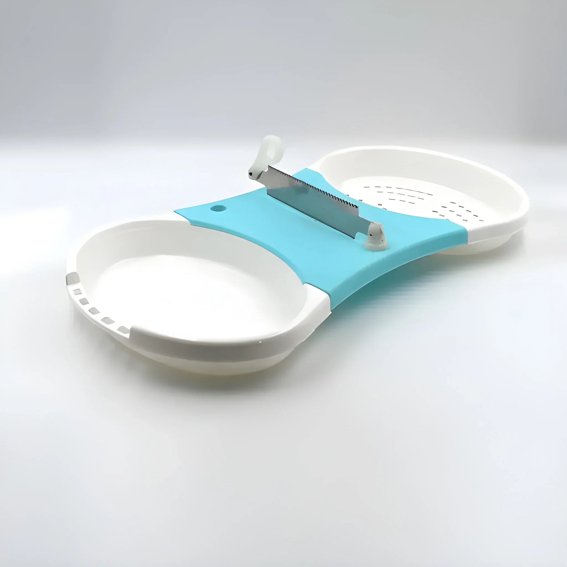 Teal and white all-in-one prep station slicer with safety ring and mounted blade