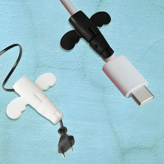 Cable protector set with white and black caps, covering connectors and joints