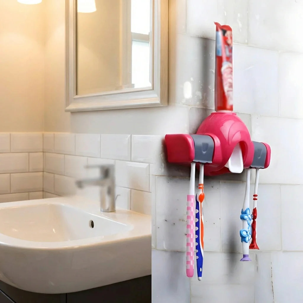 Red automatic toothpaste dispenser on bathroom wall with toothbrush holders