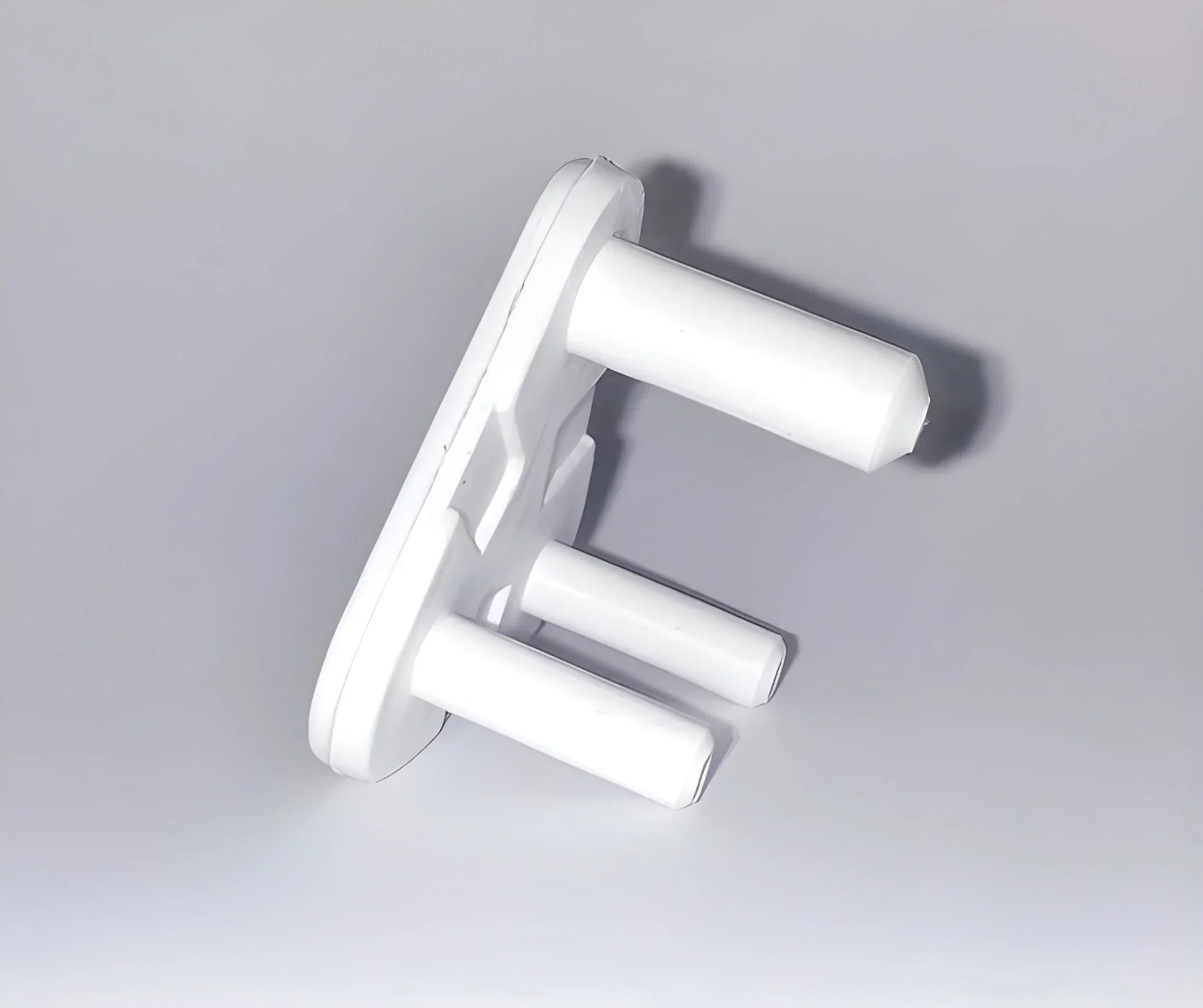 White baby socket safety covers with two prongs