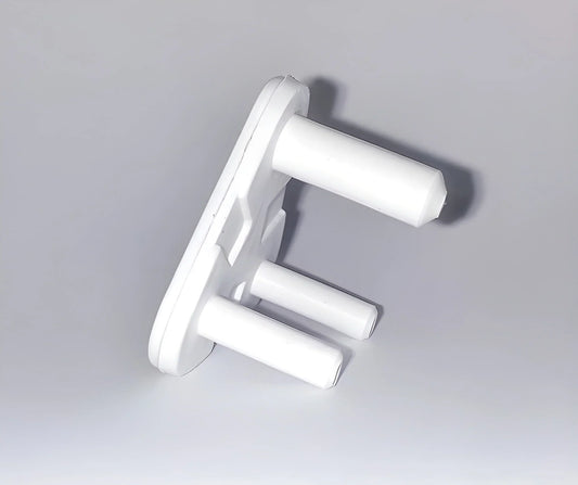 White baby socket safety covers with two prongs