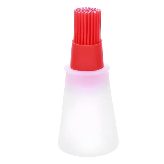 Silicone pastry basting brush with red bristles and white handle
