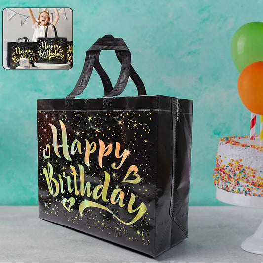 Happy Birthday gift bag with black matte finish, glittery lettering and star graphics