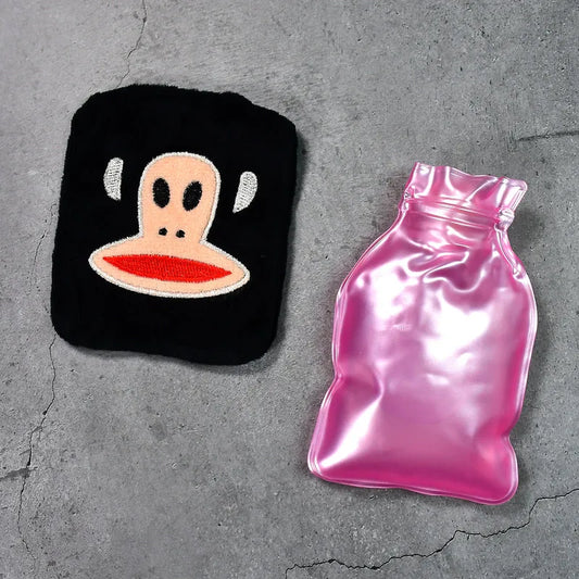 Small hot water bag with black monkey cover and pink rubber insert