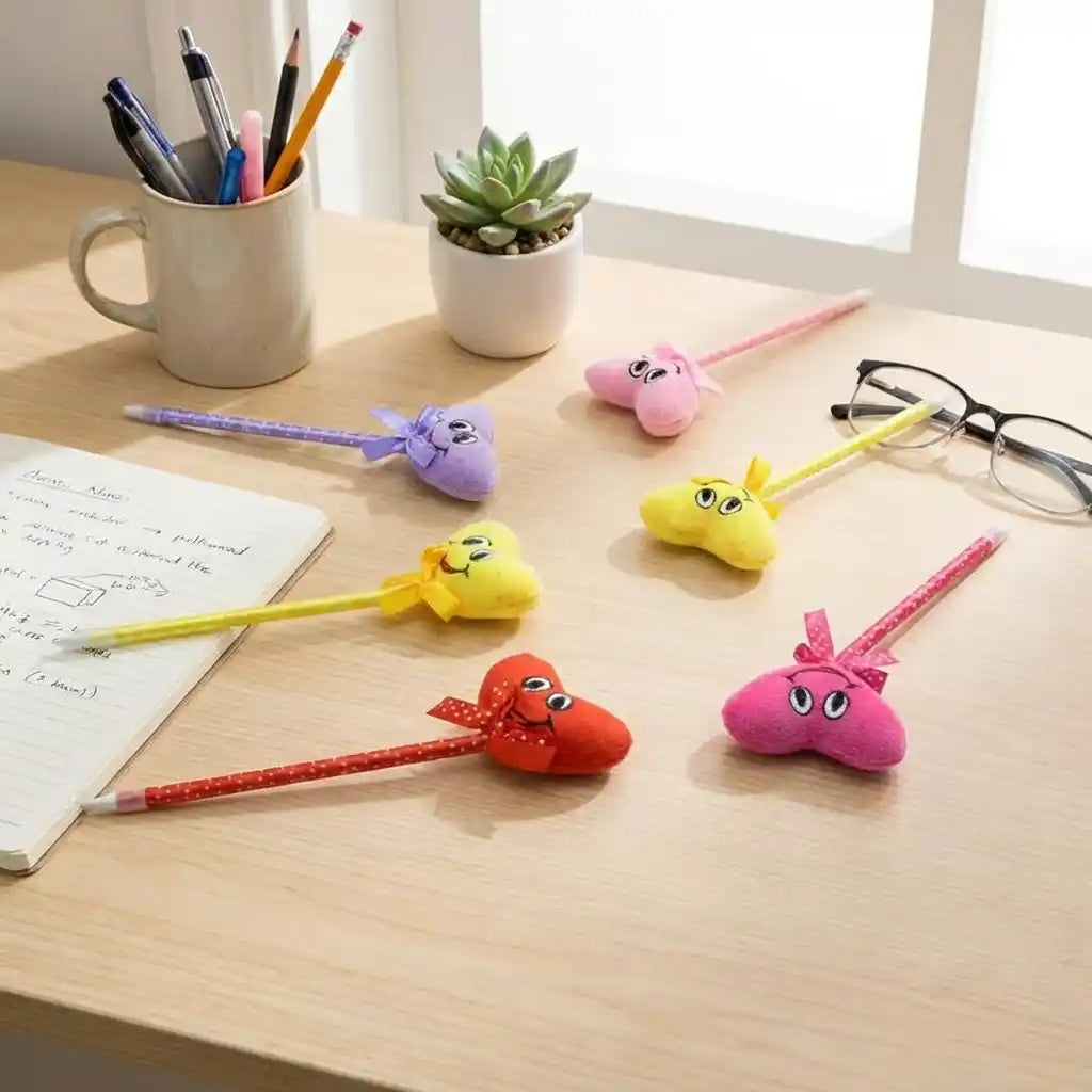 Cartoon heart pens with plush animal heads and bows on a study desk