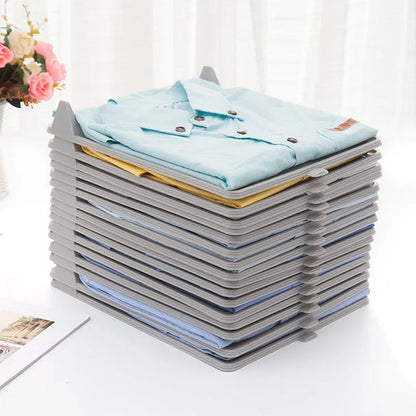 Cloth organizer holding a stack of folded light blue shirts