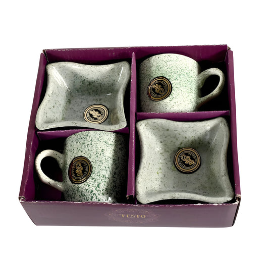 Ceramic cup and bowl set with speckled light gray glaze, gold logo