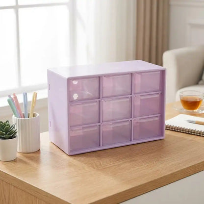 Compact jewelry drawer organizer with 3x3 clear drawers, purple tinted, on tabletop