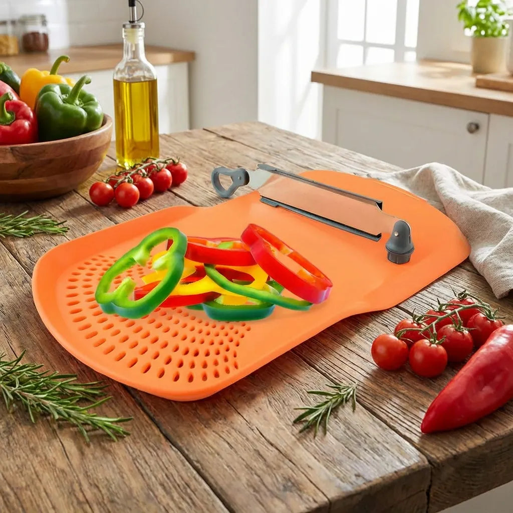 Orange perforated cutting board with pepper strips, knife, and herbs on wood