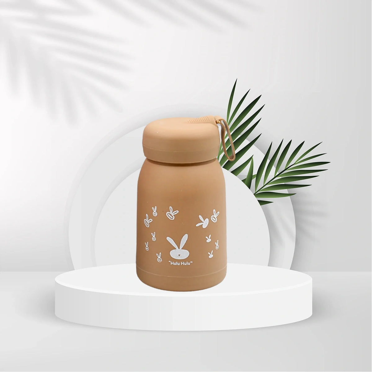 Kids water bottle with bunny graphic, tan bottle and beige screw cap