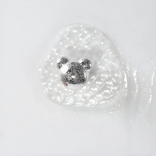 Adhesive hook with clear round backing and silver hook head