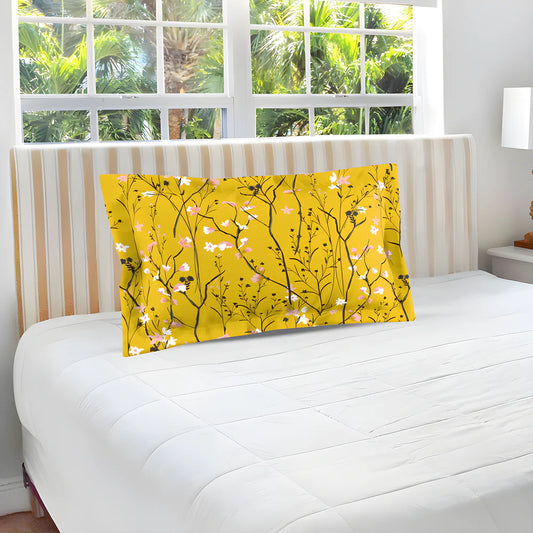 Yellow decorative pillow cover with black branch pattern and pink flowers
