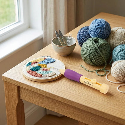 DIY craft punch needle set with punch tool, round embroidery hoop, and blue-green yarn balls