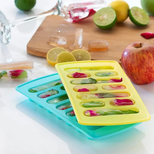 Fancy ice cube tray with fruit-filled compartments, yellow and turquoise.