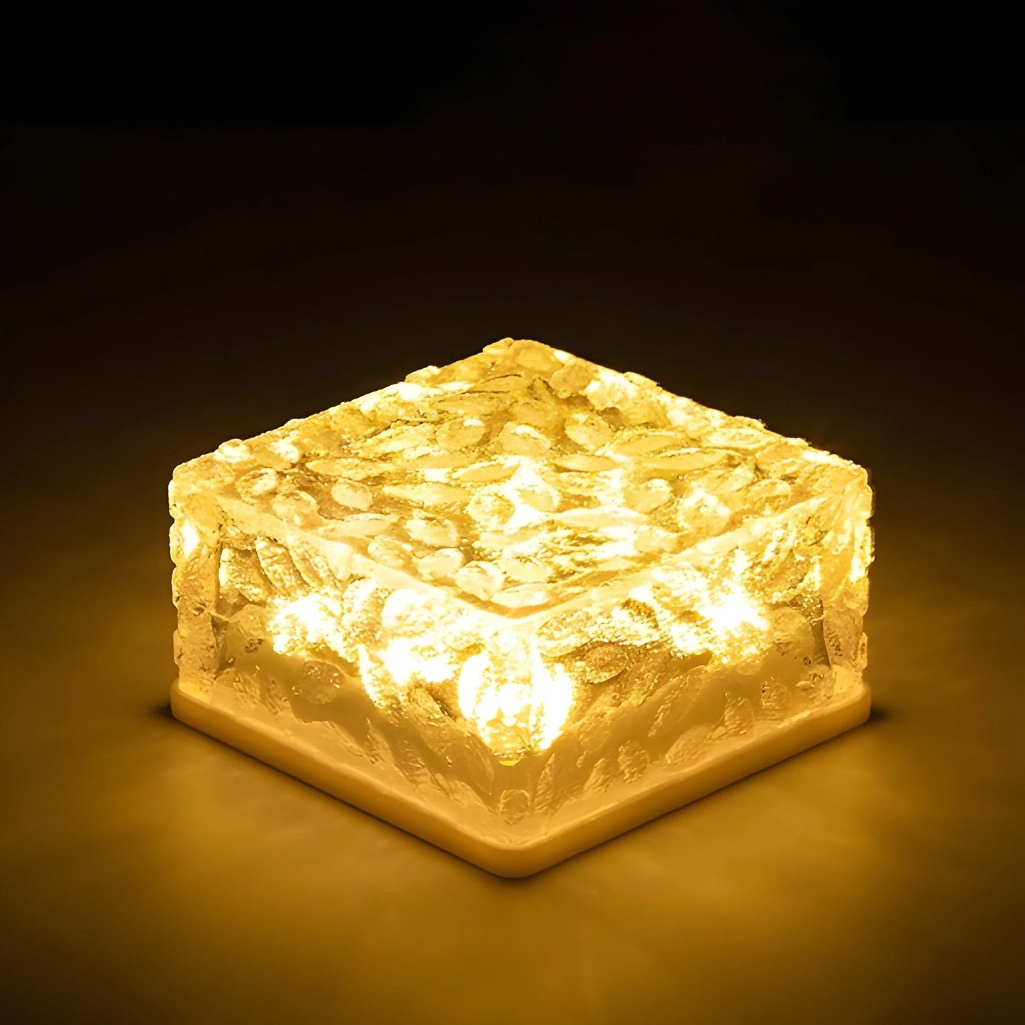 Floating solar ice light with glowing yellow translucent ice block