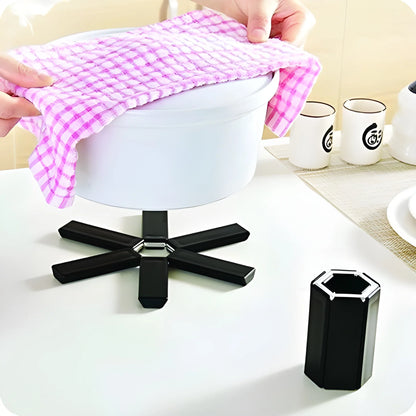 Foldable silicone hot mat, purple checkered fabric sheet folded on display