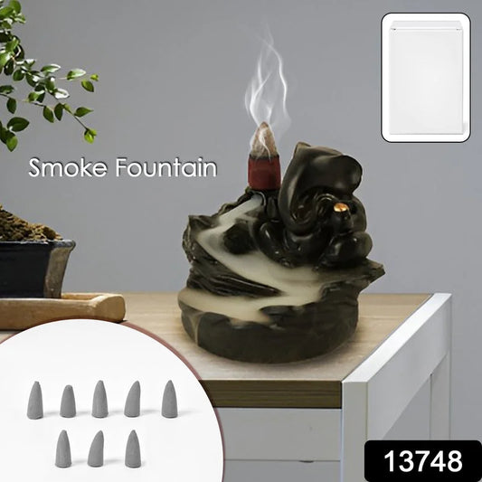 Ganesha smoke fountain idol, dark resin figurine with upward smoke plume