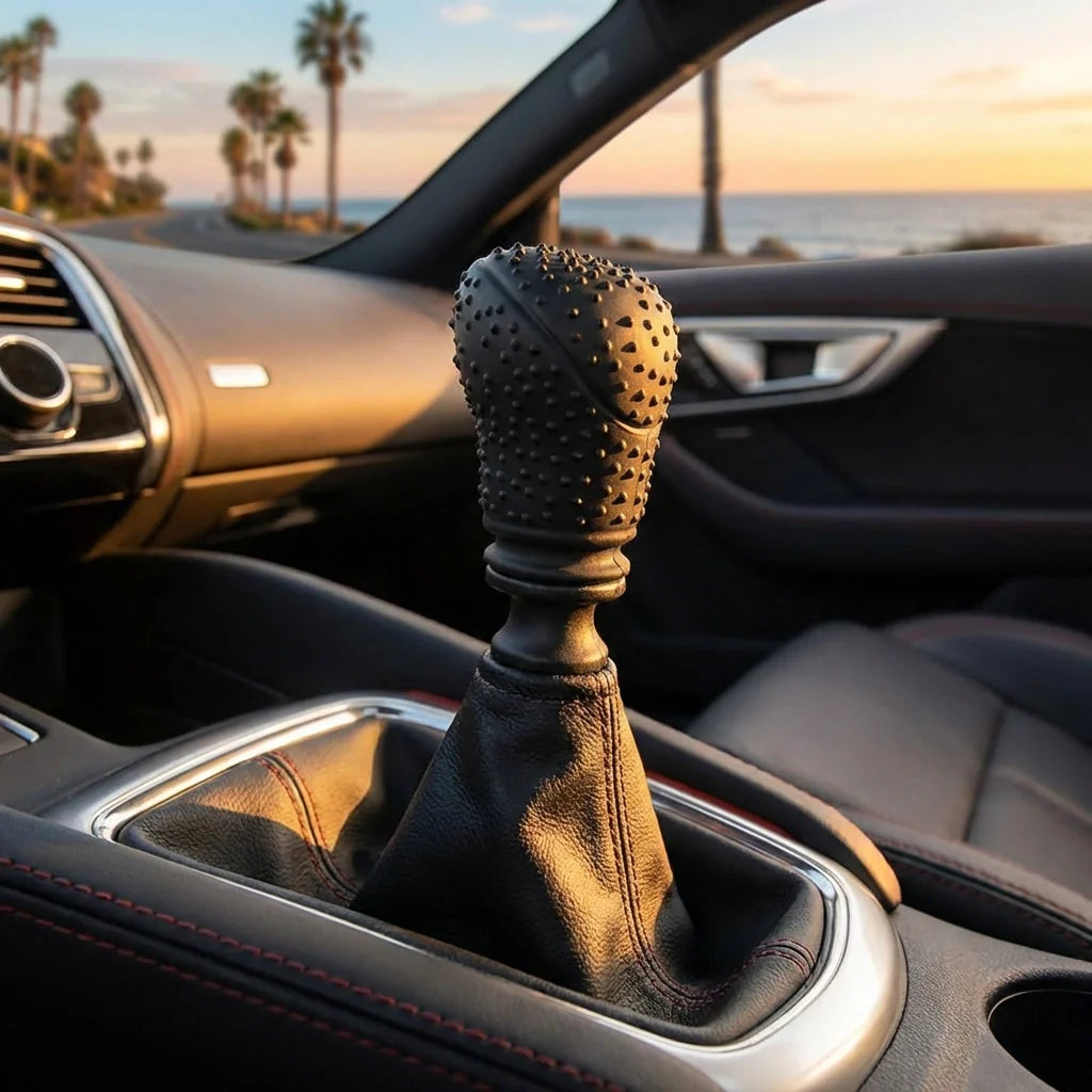 Studded black gear knob cover with leather-style boot and stitched seams