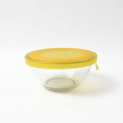 Glass mixing bowl with yellow lid, no contents