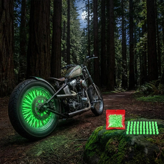 Neon green glowing wheel valve caps on a motorcycle tire