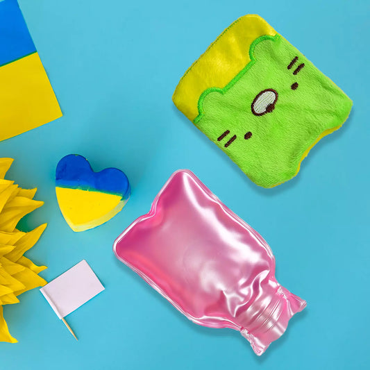 Pink hot water bag with green kitty cover, smiling face applique