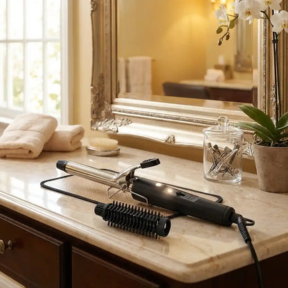 Hair curling iron on counter with black handle, chrome barrel, and roller comb