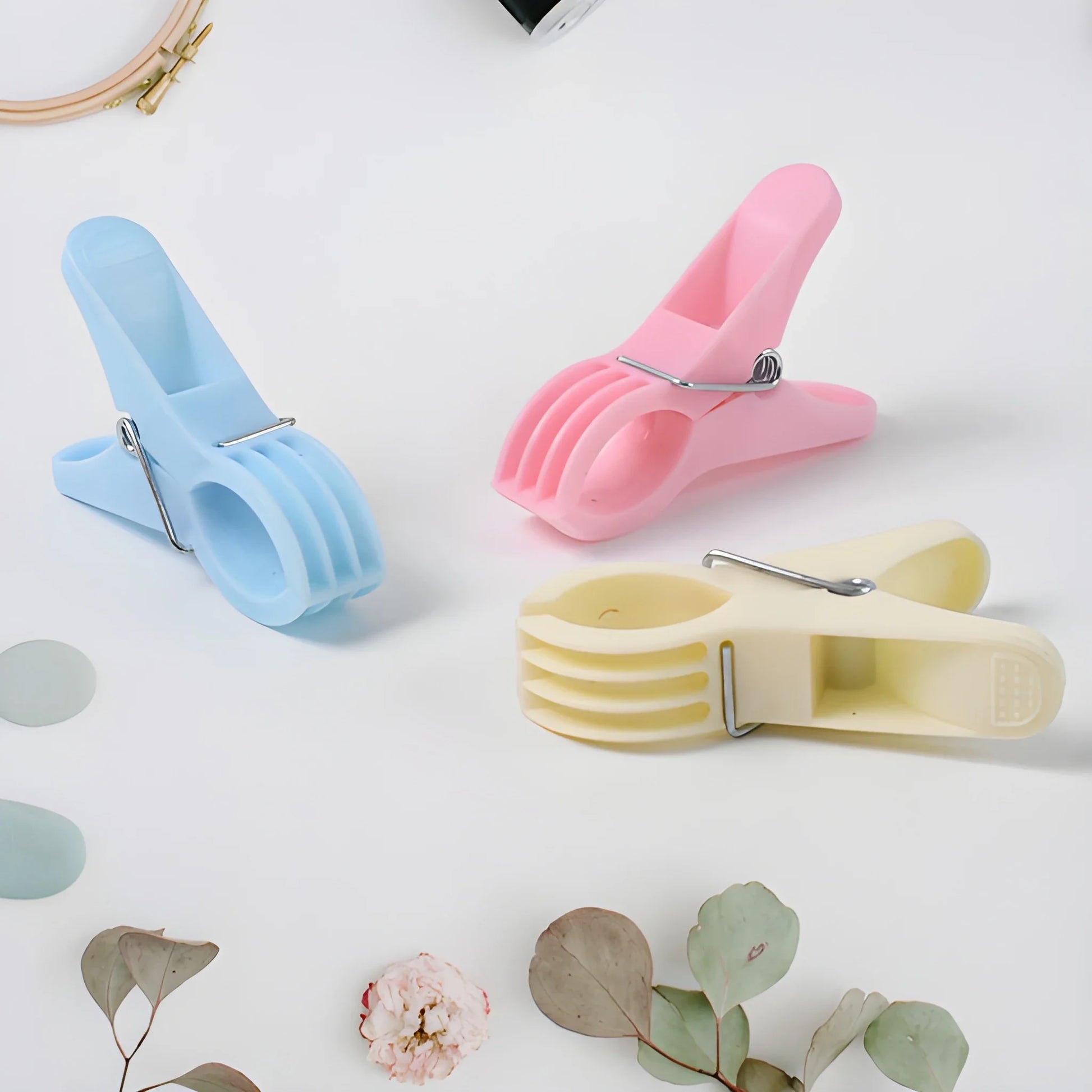 Heavy-duty multipurpose plastic clips with metal spring, blue, pink, yellow, and cream