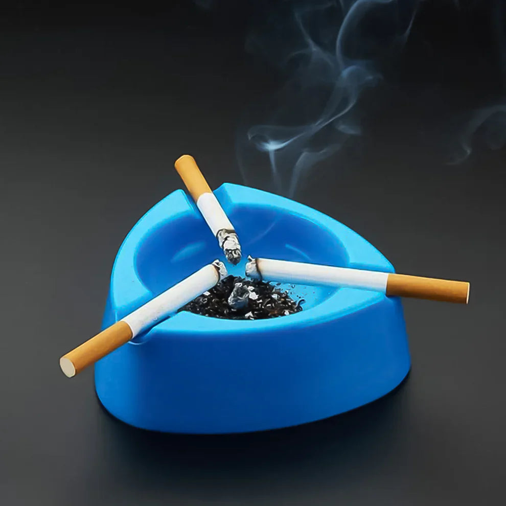Blue plastic ashtray with cigarettes and ash