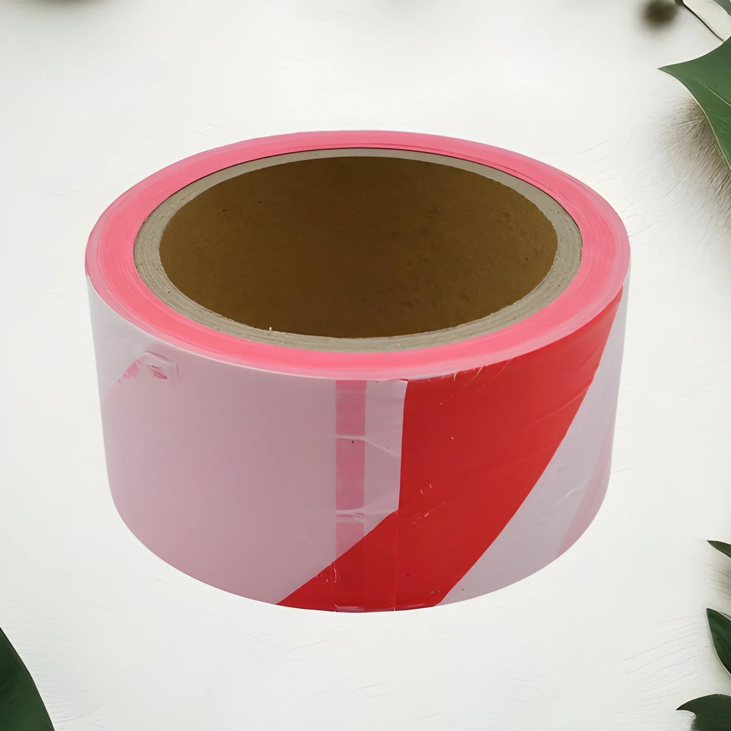 Safety warning tape roll with red and white diagonal stripes