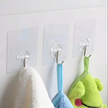 Heavy-duty wall hooks with clear mounting plates, holding towels in white, blue, and green
