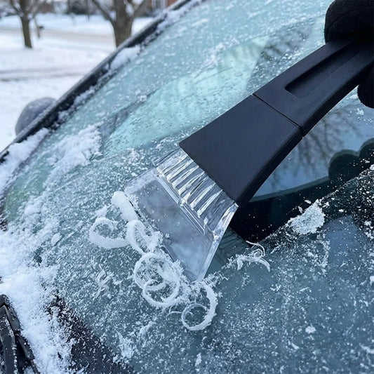 Car window ice scraper with clear ridged blade and black handle